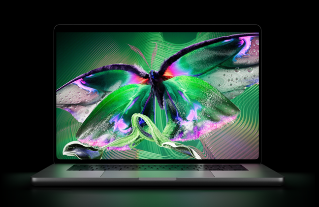 Sølvfarvet MacBook Pro med PROLED XDR-skærm, skærmen viser et detaljeret billede med høj kontrast og levende farver, tastaturet oplyses af skærmen