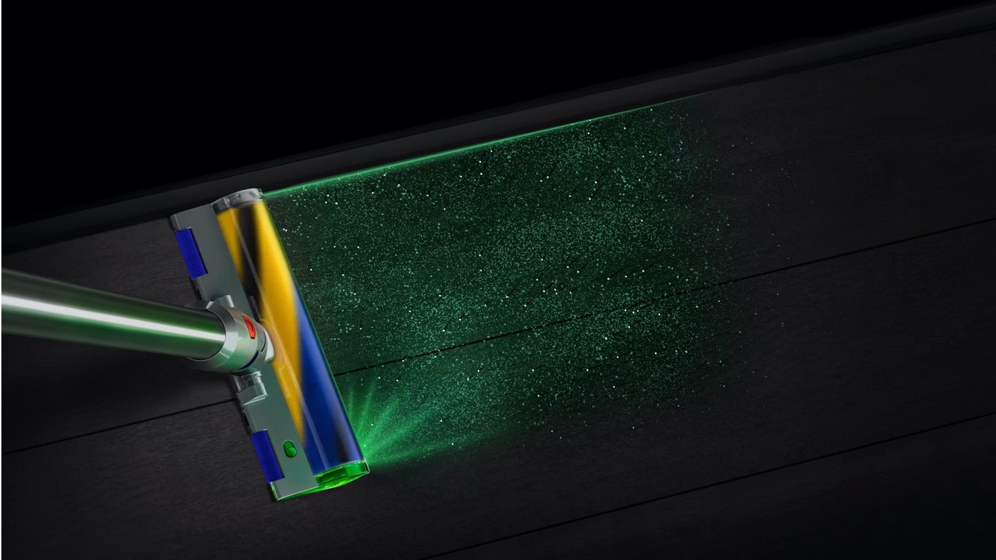 Dyson V15 støvsuger på et gulv med et grønt lys, der viser alle partiklerne