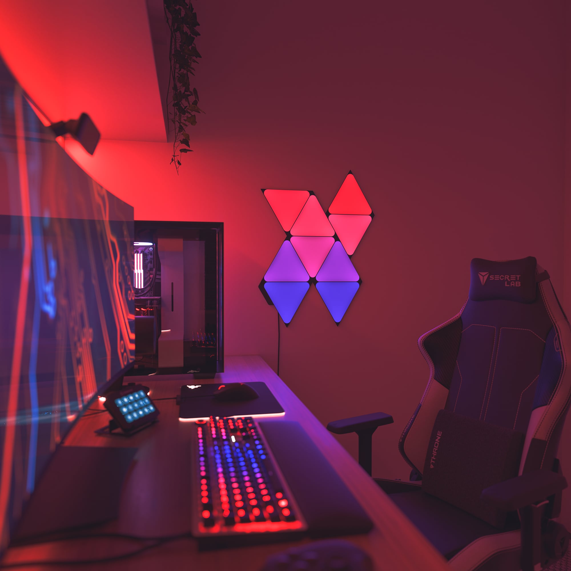 Nanoleaf Black Triangle's red, purple and blue light panels and a gaming room
