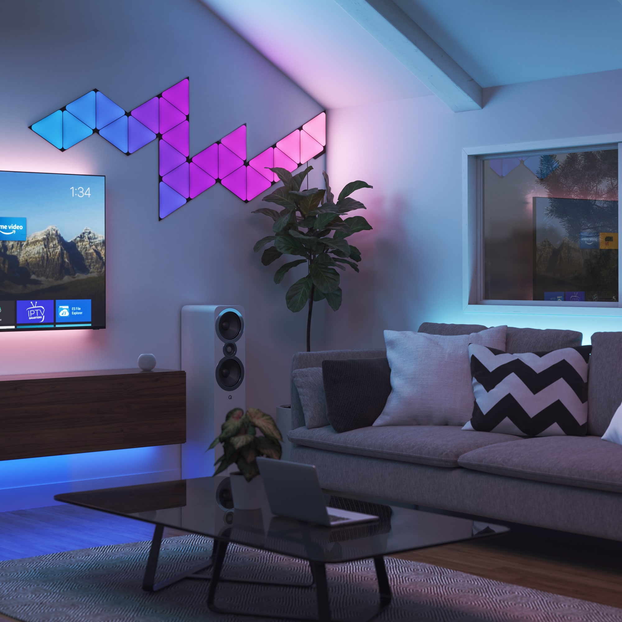 Blue, pink and purple Nanoleaf Nanoleaf light panels synchronized with music in a living room