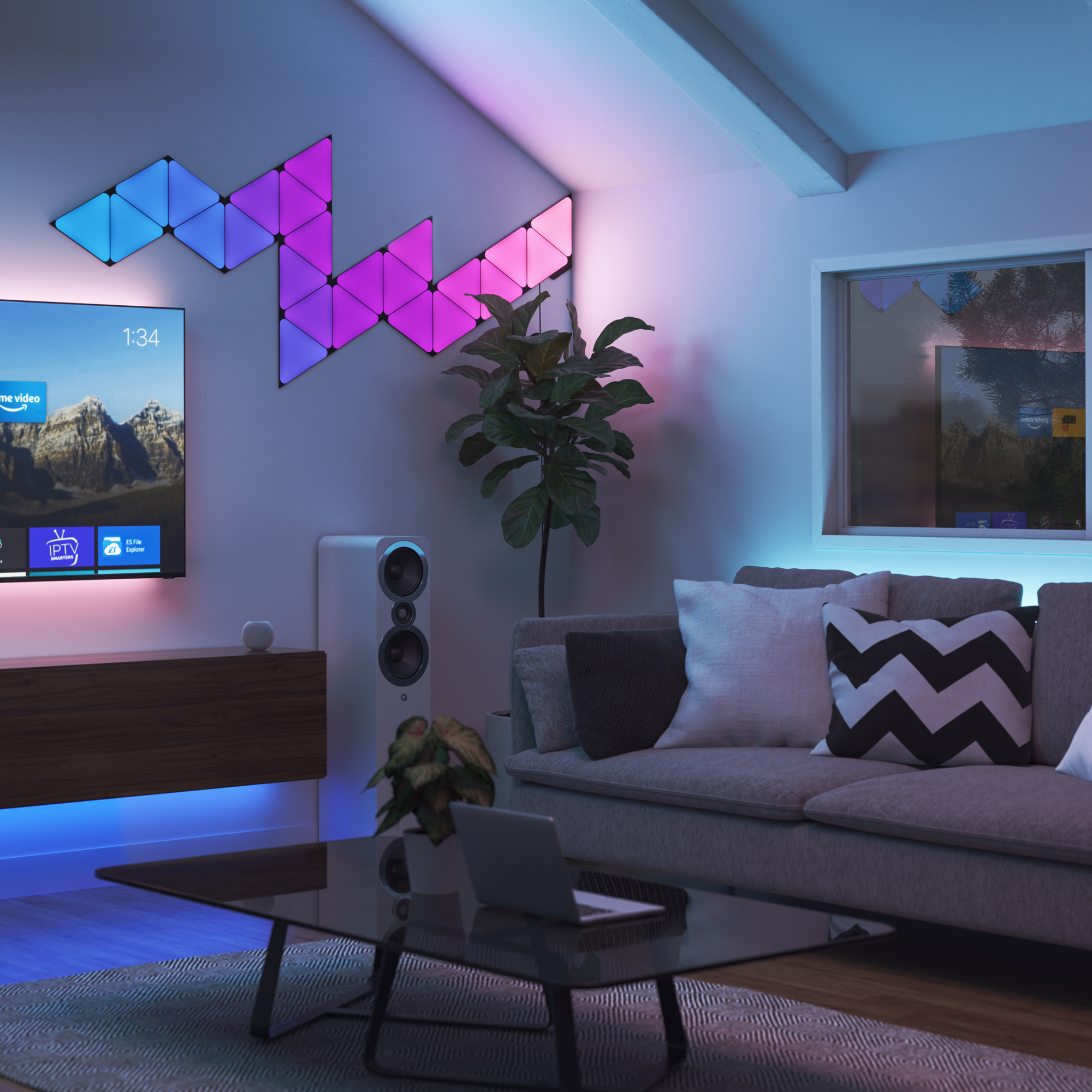 Blå, pink og lilla Nanoleaf Nanoleaf lyspaneler synkroniseret med musik i en stue