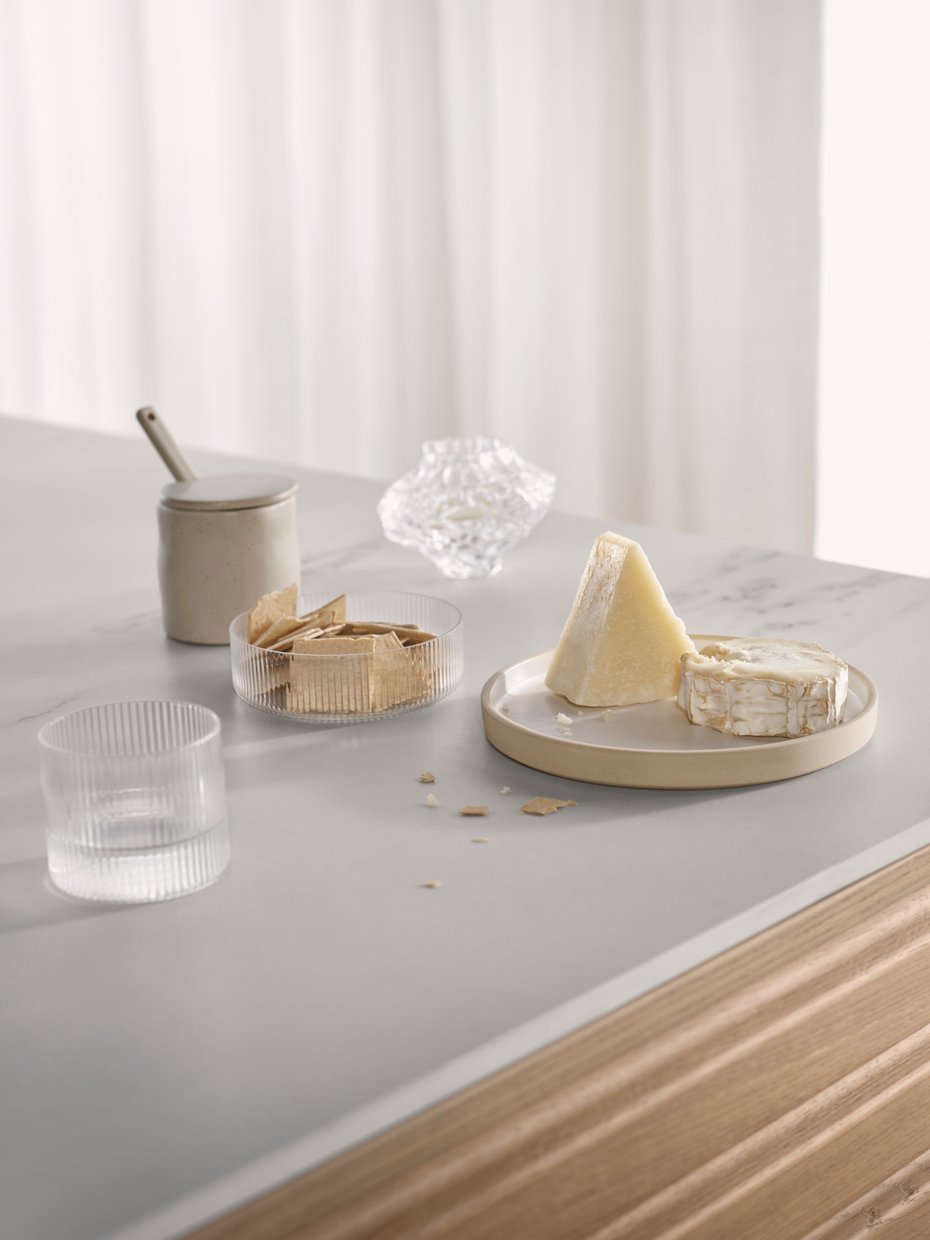 Epoq - kitchen - cheese and plates on a countertop