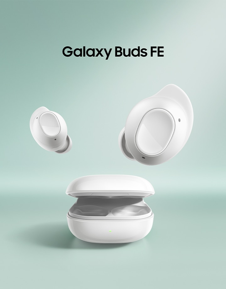 A close-up of two Galaxy Buds FE earbuds hovering.
