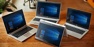 Fire HP bærbar computere på et bord