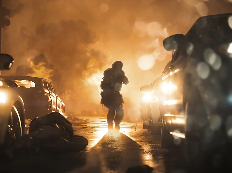 Call of Duty - skærmbillede fra spillet - en mand midt på vejen omgivet af biler