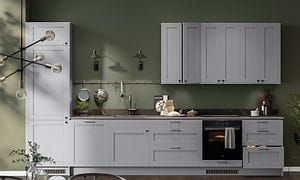 Kitchen with grey cabinets against green wall