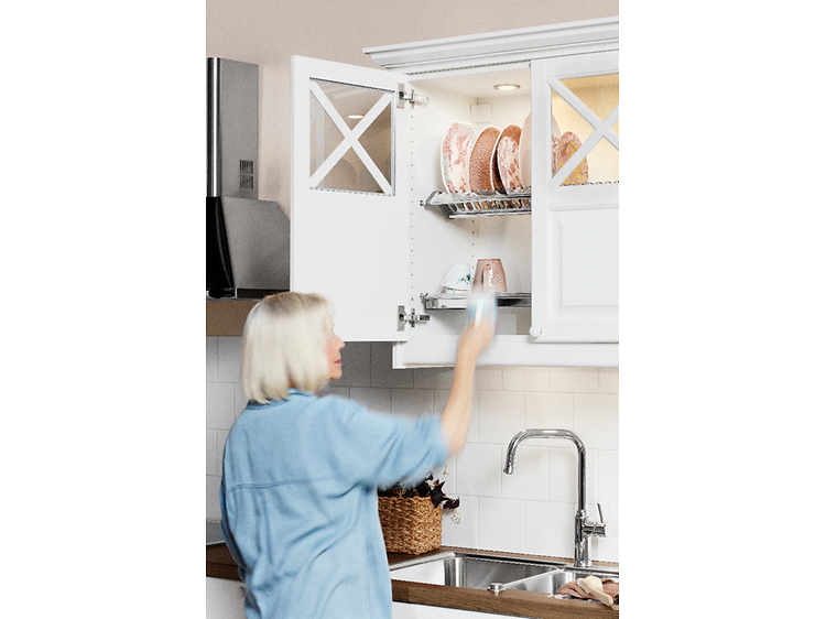 Woman in front of white kitchen