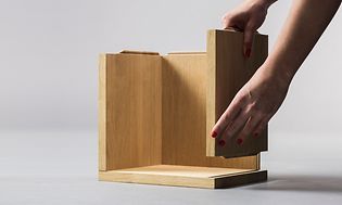 Threespine cabinet being assembled