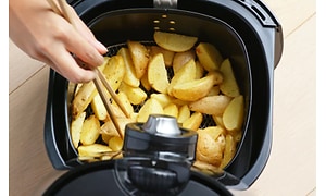chopped potatoes in an air fryer