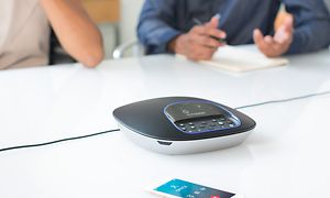 Video conference with Logitech system with two people on a background