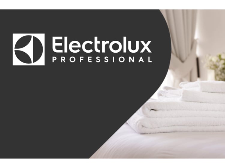 Hvide håndklæder ved siden af teksten Electrolux Professional