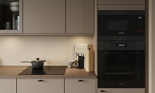 Epoq kicthen in sand with two black integrated ovens