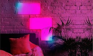LIFX Tile with pink and blue light on a living room wall