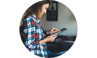 Woman in living room looking at tablet