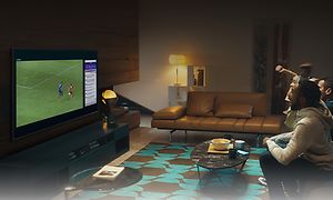 Samsung-TV-AU9075-People watching football from sofa