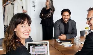 woman-and-two-men-sitting-at-a-c