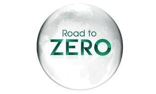 Teksten 'Road to Zero' med grå globus og bæredygtighedstema