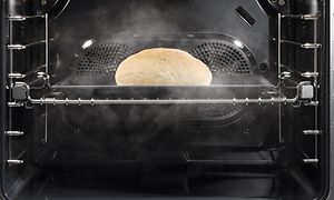Bread being baked inside Miele's combined steam oven with Moisture Plus function