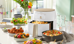 Hvid Philips Airfryer XXL og præsentation af dens alsidighed til brug til forskellige retter