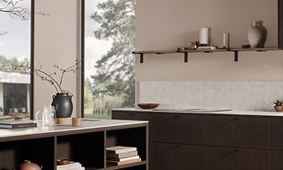 Dark oak kitchen with a white worktop