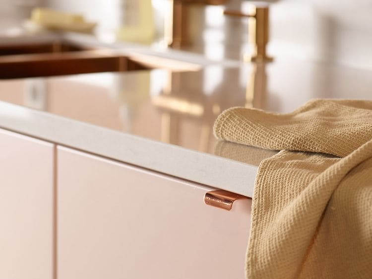 Epoq Trend Blush kitchen with Silestone worktop and a kitchen towel