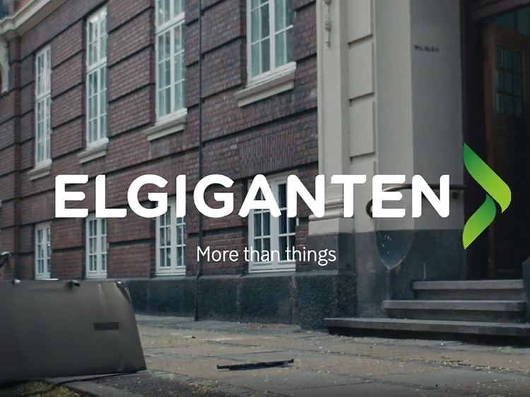 Bygade med Elkjøp logo og teksten More than things