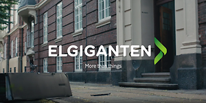 Bygade med Elkjøp logo og teksten More than things